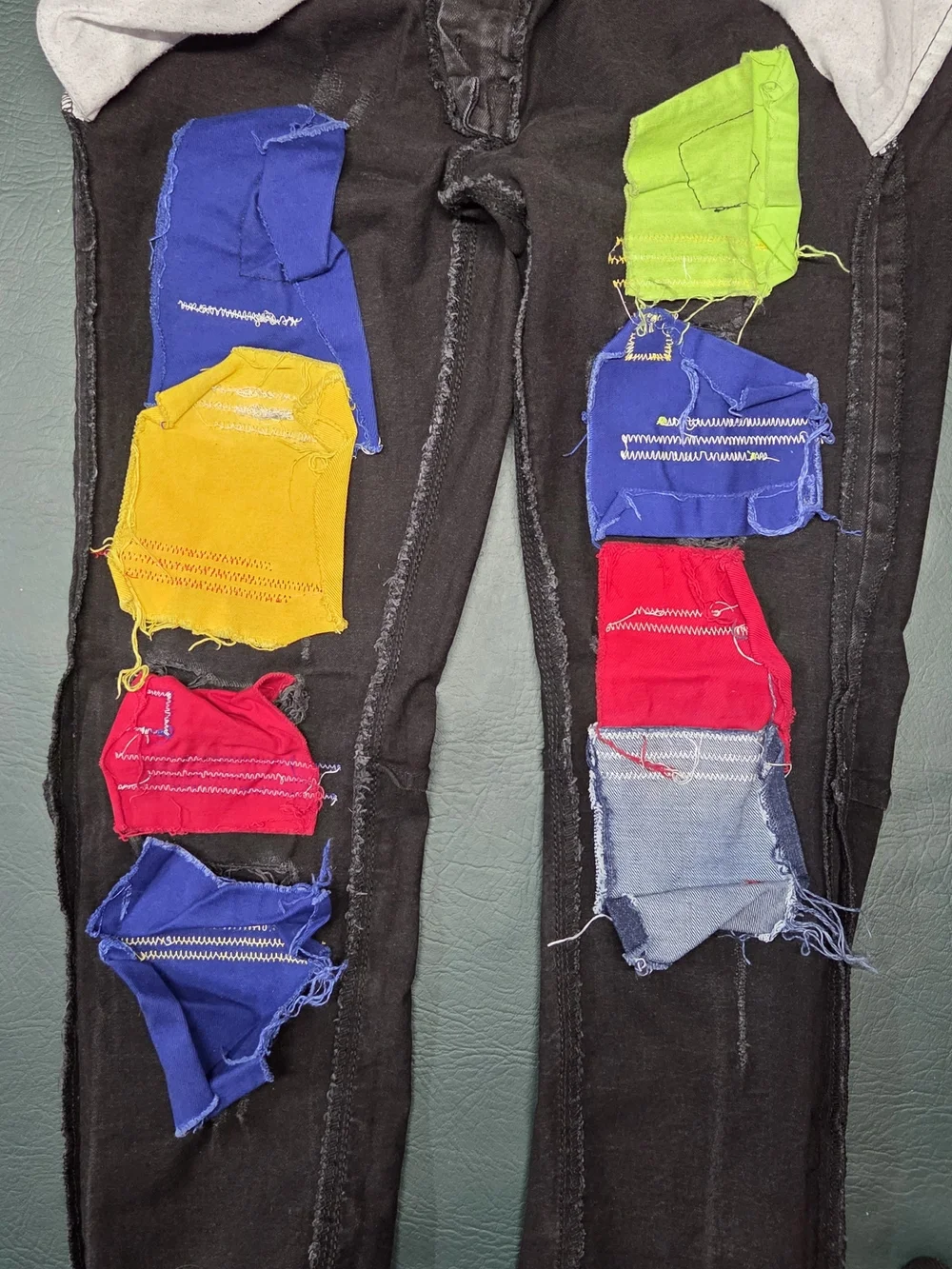 **Black Distressed Men’s Jeans with Color Patch Accents** - Picture 7 of 14